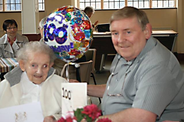 Millicent Stringer celebrating her 100th birthday with her son, Trevor
