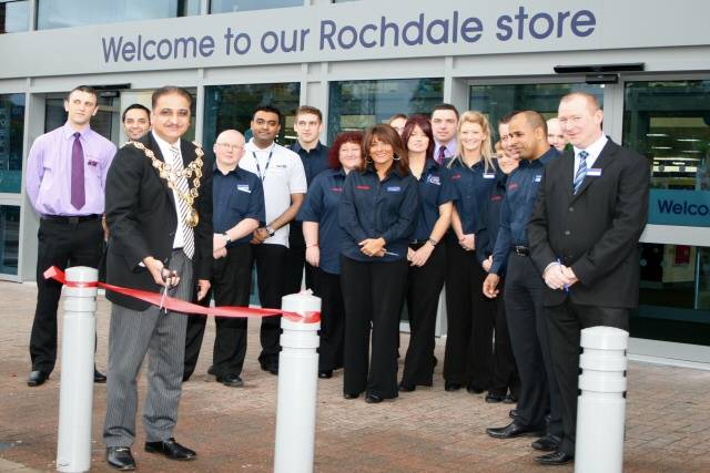 The Mayor of Rochdale, Councillor Zulfiqar Ali cuts the ribbon to the new PC World and Currys store in Rochdale