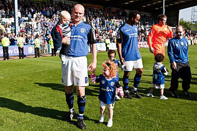 Dale captain Gary Jones with his children on the lap of honour