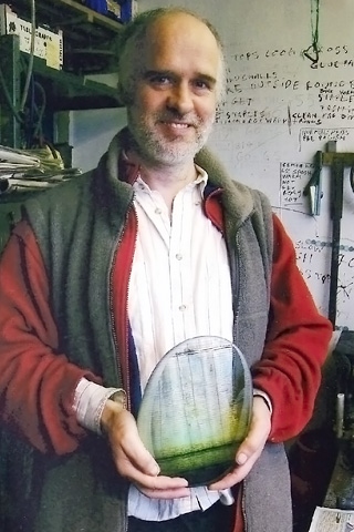 Brian Blanthorn holding a piece of his glass
