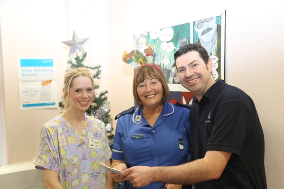Andrew Schofield from RRG Rochdale, giving the team’s vouchers to Margaret Larner and Angela O’Neil at Fairfield Hospital
