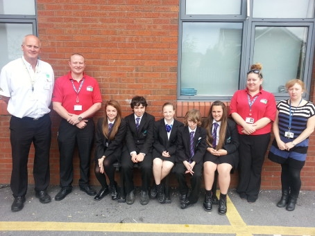 Year 8 and 9 pupils from St Anne’s Academy who have completed road safety training with (l to r) Stuart Howarth, Dave Godley and Wendy Andrew from Rochdale Borough Council’s Casualty Reduction Team and Diane Davies, the school’s PSHE co-ordinator 