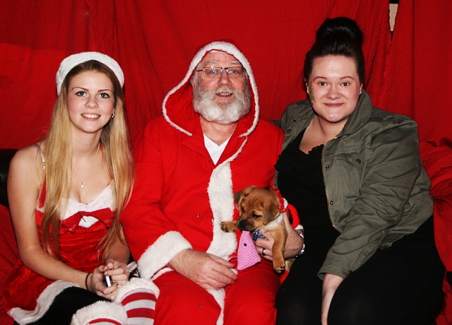 Father Christmas and his helpers at Leonard Cheshire Home Christmas Fair