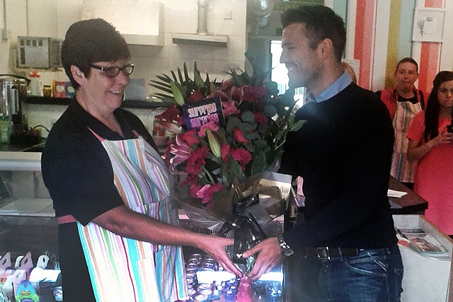 Mark Wright delivers flowers to Sue Scott