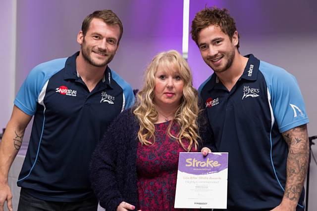 Debbie Ainscow received her certificate from Sale Sharks rugby stars, Mark Cueto and Danny Cipriani 
