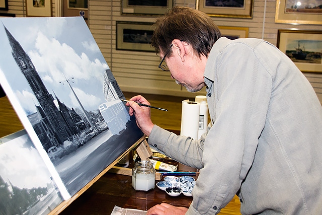 Geoff Butterworth painting at his exhibition