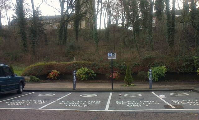 The FSB says businesses can't afford to upgrade vehicles to less polluting ones, such as electric (pictured: electric vehicle charging posts at the rear of Rochdale Town Hall)