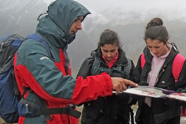 Fida Hussain helping with a community mountaineering project
