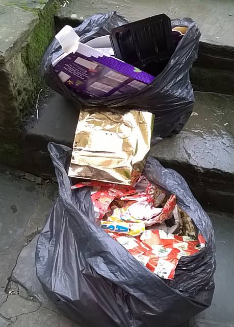 Black bin bags containing present wrappings dumped from a white Vauxhall Zafira on Christmas Day whilst driving down Ashworth Road
