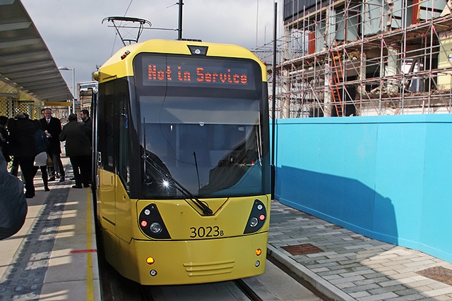 The VIP passengers disembark form the tram at the town centre Metrolink stop