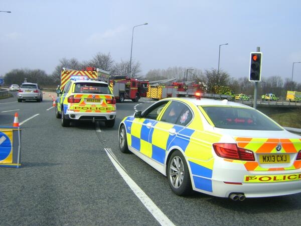 Emergency services at the scene of the overturned lorry