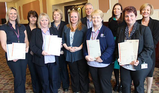 RBH wardens with their diplomas (l-r) Karen Wood (Saxon House and Olive Standring House), Beverley Martin (Alkrington Court and Chisholm Court), Joanne Barber (Lonsdale Court), Margaret Grice (Isherwood Close and Springfield Close), Karen Turner (Assessor - Lemon & McCarthy), Peter Smith (Support and Independence Manager), Yvonne Kowalczuk (Yew Court and Jack McCann Court), Clare Tostevin (Head of Strategy & Regeneration), Karen Tweedale (Moss Row) and Rose Ogden (Sheltered Housing Service Co-or