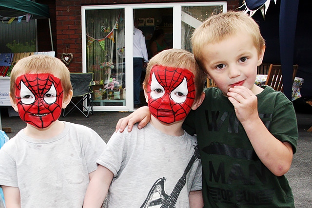 Alfie, Harry and Ben Gammon enjoy the fete