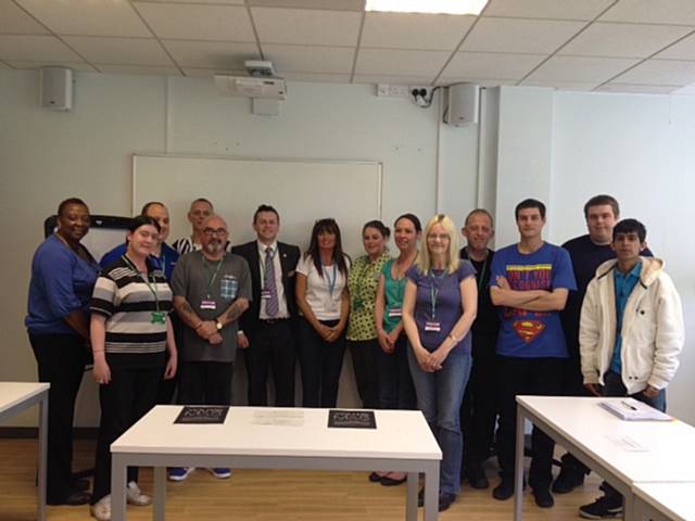 Nick Bluer, Marks & Spencer Manager (centre, with tie) with students