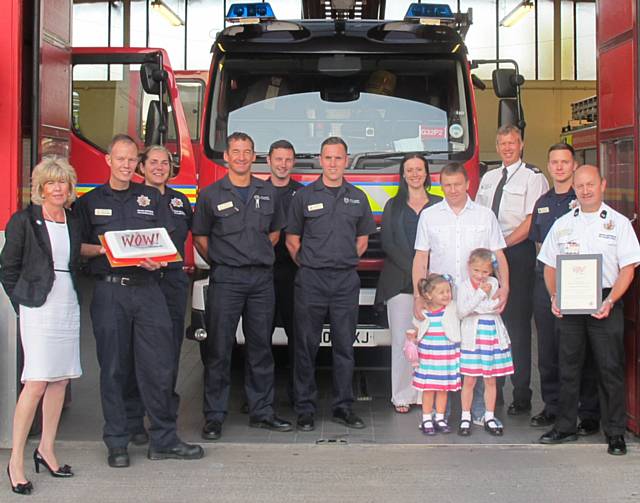 Green Watch Heywood with (far left) Kim Leitch from WOW! Awards, (far right) crew manager Dave Dawson, (rear second right) Rochdale Borough Manager Paul Starling and nominator Katie Bartle with family