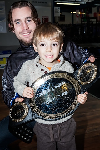 Four-year-old Isaac Journeaux with Martin Stapleton and his world title belt