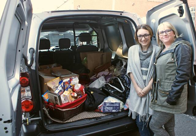 Rebecca Hughes and Joanne Lord with donations for the homeless through ‘Mission Christmas’
