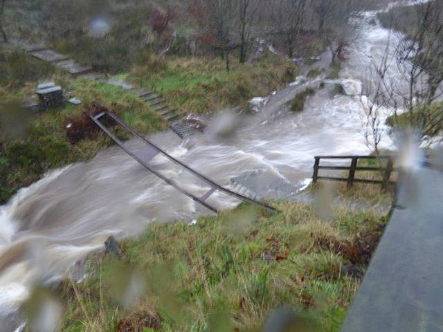 One of the bridges around Watergrove demolished by the fast flowing stream