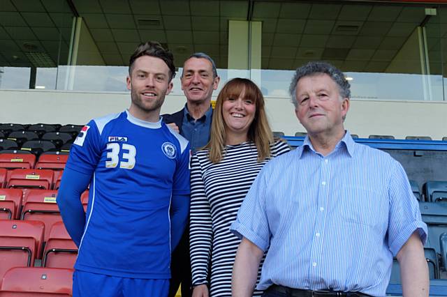 L to R Rochdale footballer Tom Kennedy  & from Petrus Denis Skelton, Co-ordinator, Sonia Denham, Project Leader & Peter Galvin Vice-Chair of Trustees.