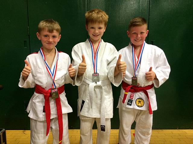 Junior members of Rochdale Judo Club; Taylor Whitehead, Dylan Cape and Jake Brearley proudly wearing their medals