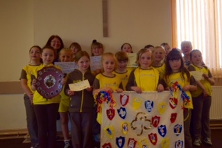 9th Heywood (St Margaret’s) Brownies with their mascot of a Division Banner