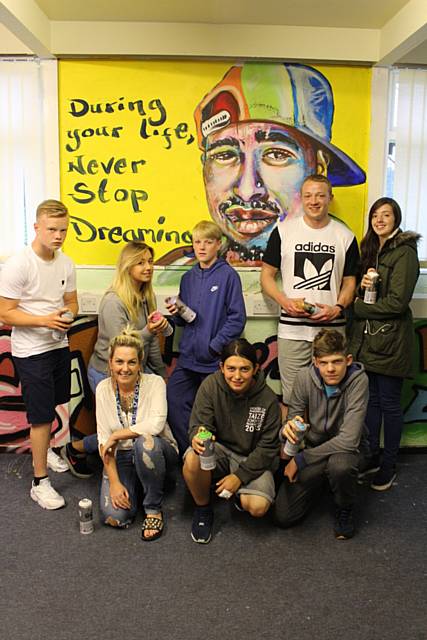 Rhodes Youth Club members show off their handiwork with artist Evan Barlow and Amanda Mullen from Rochdale Youth Service