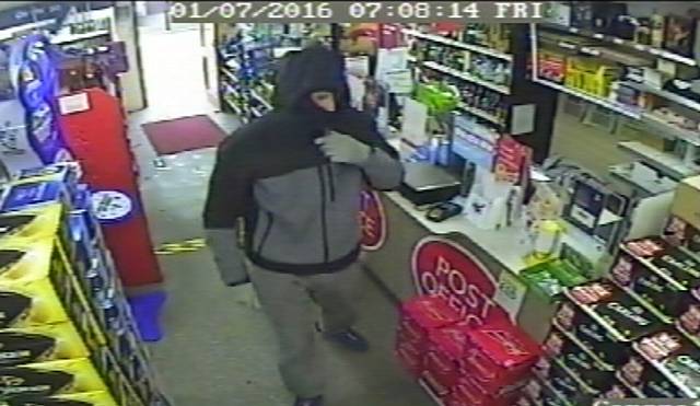 Still from CCTV footage of armed robbery at Bargain Booze, Littleborough