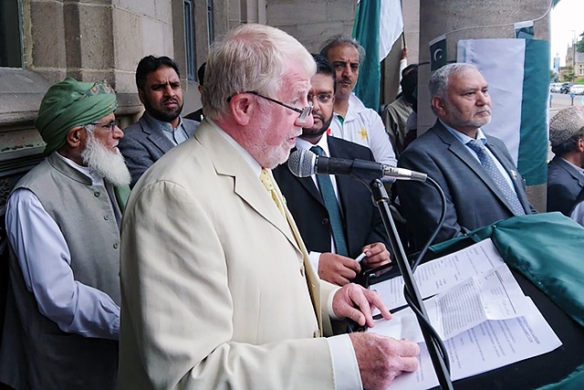 Councillor Allen Brett addresses the crowd at the Pakistani Flag raising at Rochdale Town Hall