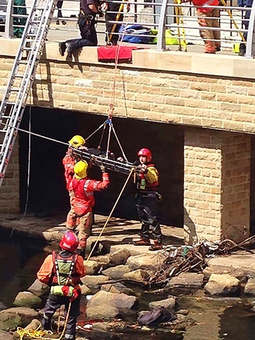 Man being rescued from the River Roch