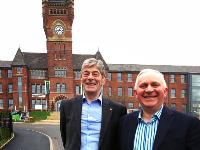 Councillor Robert Clegg and Councillor Ashley Dearnley in front of the landmark clock tower at the former Birch Hill hospital