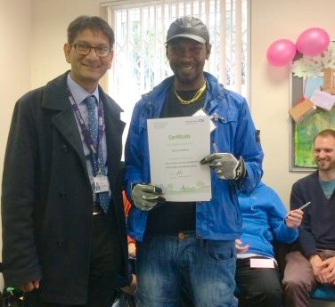 Dil Jauffur, Pennine Care’s Rehabilitation and High Support Directorate Manager (left), presenting students with their certificates