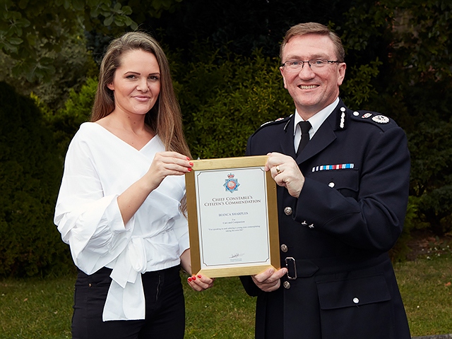 Bianca Sharples receiving her award from Chief Constable Ian Hopkins