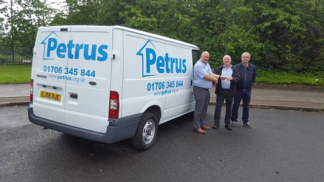 Ian Phair, fleet manager at M&Y Maintenance and Construction, hands keys to Martin Topham of Petrus