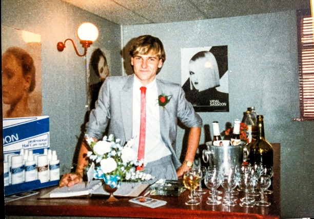 Greg at the reception counter of the salon