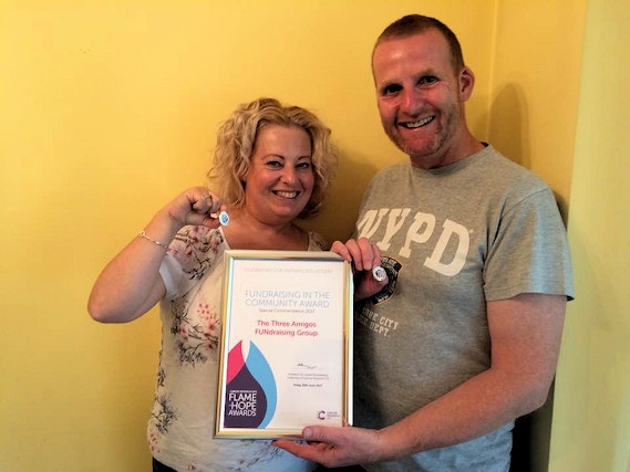 Kath and Andy O'Donnell, of The Three Amigos Fundraising Group, have been awarded a Cancer Research Flame of Hope