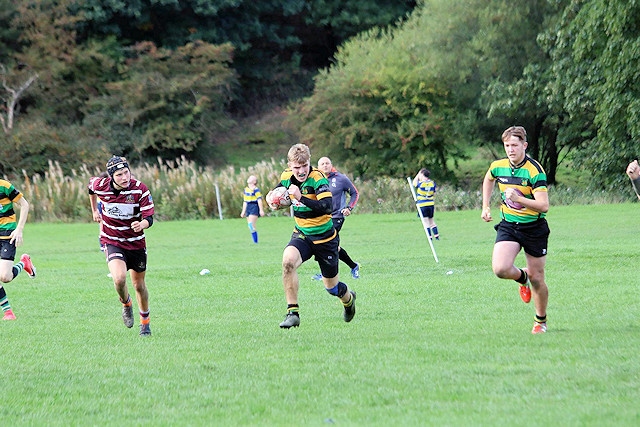 Charlie Sutcliffe on his way to the try line