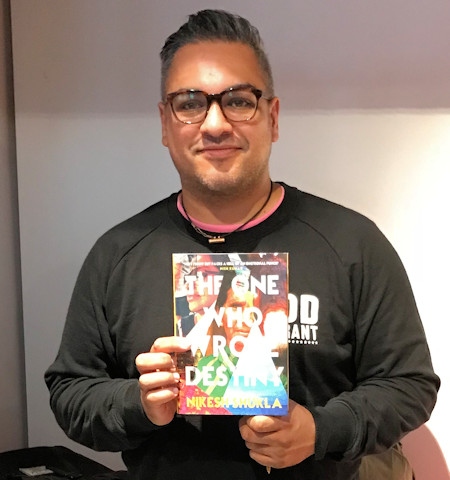 Nikesh Shukla with his book