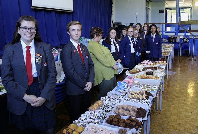 Students at Whitworth Community High School prepare for the Macmillan cake bake sale rush