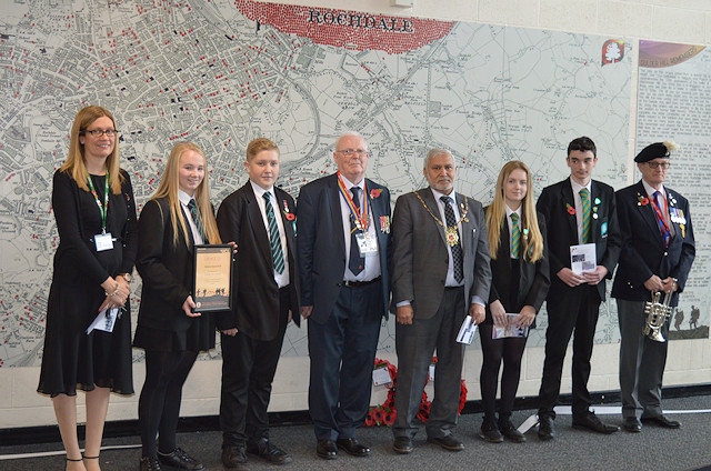 Rebecca Tarran (Teaching and Learning Director – Humanities); Jenna Holt and Jake Idiens (designers of the legacy project); Wing Commander David Forbes (President of the Rochdale branch of the British Legion); the Mayor Of Rochdale; Lily Mangan (Head Girl); Alex Peckitt (Head Boy); Mr Lawson (who played the Last Post on the bugle for us)