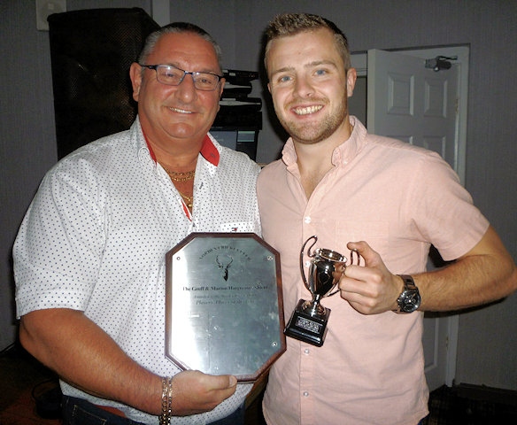 Greg Butterworth receives the Asif Mujtaba Shield and the Marion Hargreaves Trophy as the Norden Cricket Club players’ player of the year from Ian Austin