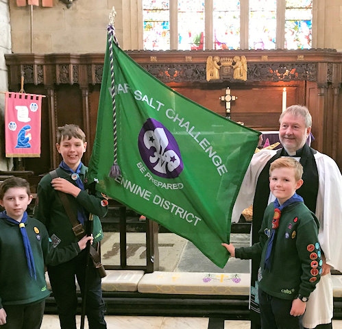 1st Middleton (Boarshaw) Scouts; Andrew Singleton, James Marshall Oliver Hewitt and Kian McCarthy, receive the Mark Salt Flag in St Leonards Parish Church, Middleton with the Revd Martin Short 