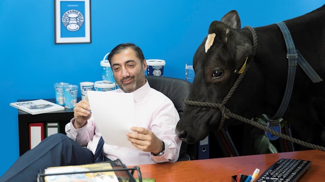 Azhar Zouq, managing director of Lancashire Farm Dairies and Olympia the cow