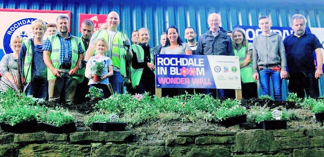 Volunteers joined forces to plant the new ‘Wonderwall’ at Rochdale’s Crown Oil Arena