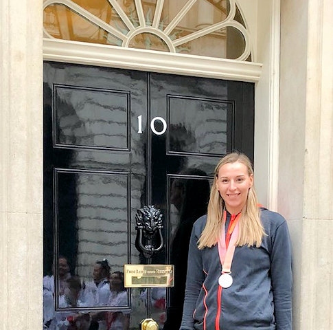 Mollie Campbell, from Whitworth, is presented with her silver medal at Downing Street