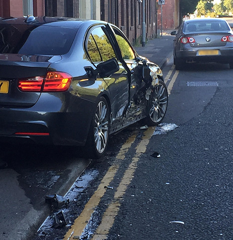 A grey BMW 335D collided with a silver Toyota Corolla