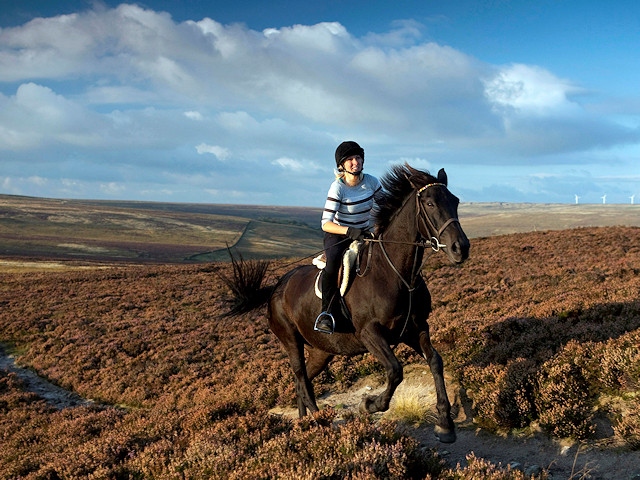 Horse rider gallops across the South Pennine landscape, cited in a government report on the nation’s most precious areas