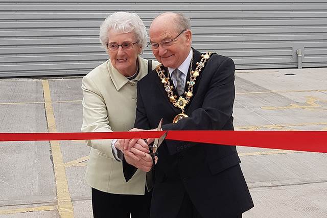Mayor Billy Sheerin cuts the ribbon with owner and Chief Executive Phil Cornell's mum