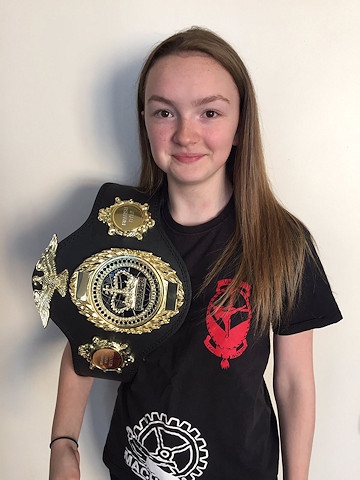 Thai Boxer Abbie Hughes with her British Championship Belt