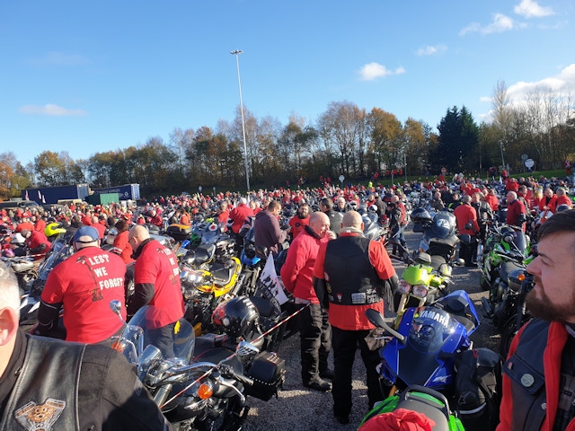 Thousands of bikers wearing red at Birch Services, ready to turn the M60 into a giant poppy