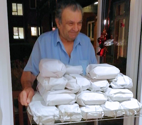 Ken Pashi delivering a free dinner